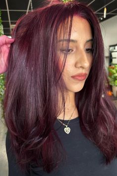 Lush and vivid, this maroon hair color radiates a profound allure. Its smooth and lustrous finish accentuates the multidimensional tones, allowing the maroon hues to shine brilliantly under the light. Ideally paired with long, silky locks, this color transformation adds a sumptuous touch to any style. - Click to see more of Captivating Maroon Hair Hues: 30 Stunning Shades for the Stylish and follow us for more hairstyle ideas. // Photo Credit: Instagram @colorbymarisa Ashy Burgandy Hair, Burgundy Hair With Brown, Burgundy Magenta Hair, Bellami Mulberry Wine Hair, Cool Tone Burgundy Hair, Burgundy Hair With Lowlights, Mohagni Hair Color, Hair Color Ideas Fair Skin