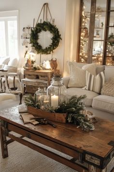 a living room filled with lots of furniture and christmas decorations on top of a coffee table