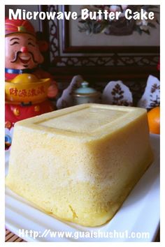 a square cake sitting on top of a white plate