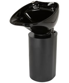 a black bathroom sink sitting on top of a trash can