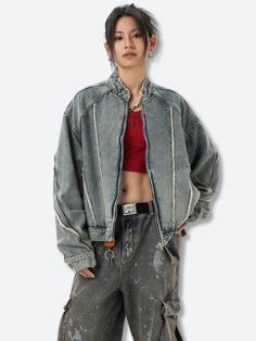 This Cyberpunk Zip-Up Denim Jacket offers a bold, industrial look with exposed seams and distressed detailing. Its oversized fit pairs perfectly with cargo pants or ripped jeans for versatile streetwear style. Cyberpunk aesthetic Denim material Zip closure at front Zip detail at sleeves Button detail at cuffs Tasseled detail Mandarin collar Long sleeve Cotton, polyester Our model wears L and is 5'4 (166cm) Denim Jacket With Multiple Pockets For Fall Streetwear, Fall Denim Jacket With Multiple Pockets For Streetwear, Oversized Edgy Jeans For Streetwear, Edgy Oversized Jeans For Streetwear, Ripped Cotton Denim Jacket For Streetwear, Long Sleeve Outerwear With Frayed Hem For Streetwear, Urban Ripped Outerwear For Streetwear, Ripped Long Sleeve Outerwear For Streetwear, Edgy Oversized Jeans With Pockets