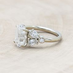 an engagement ring with three pear shaped diamonds