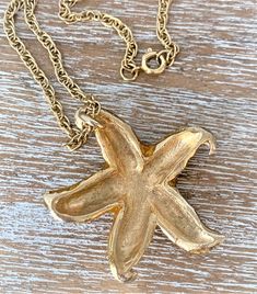 "23\" Gold Tone Rope Chain Necklace with Gold Epoxy Starfish Pendant Gold Tone Spring Ring Clasp Starfish Pendant Measures 2\" Long x 1 3/4\" Wide Starfish Pendant is Cast Metal with Epoxy Finish on Front Side Gold Tone Rope Chain Measures 1/8\" Wide Made in USA COMPLIMENTARY DOMESTIC SHIPPING" Gold Metal Jewelry With Starfish Charm, Gold Jewelry With Starfish Charm, Metal Starfish Charm Jewelry, Bubble Necklaces, Starfish Pendant, Rope Chain Necklace, Soap Bubbles, Pendant Gold, Metal Casting