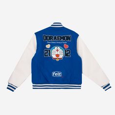 - Wool Varsity Jacket with Leather sleeves - Embroidery on front & back - Ribbed Cuffs - Snap enclosure - Embroidered Patches on sleeves - Woven Neck Label In Collaboration with Doraemon ©1970-2021 Fujiko Pro Spring Varsity Jacket With Embroidered Patch And Long Sleeve, Blue Outerwear With Embroidered Logo For College, Blue Long Sleeve Outerwear With Embroidered Graphics, Blue Embroidered Outerwear For College, White Embroidered Patch Long Sleeve Outerwear, White Long Sleeve Outerwear With Embroidered Patch, Embroidered Long Sleeve Varsity Jacket For College, Casual Cotton Outerwear With Embroidered Cuffs, Embroidered Fitted Varsity Jacket For Fall