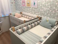 a baby's room with a crib, bed and pictures on the wall