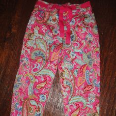 White Stag ~ Beautiful Hot Pink Paisley Print (Blue * Greens * White * Gold) Stretch Capris Or Cropped Pants. Zip & Button Front Fly * Belt Loops With Hot Pink Grosgrain Ribbon Belt * 2 Vertical Angled Pockets In Front; No Pockets In Back, But Yoke Seaming * Lighter-Weight 66%Cotton/31%Nylon/3%Spandex (Stretch). Tags Say Size 6 And Size 7 Petite, But These Are Cropped Pants So That's Immaterial. Please Check Measurements Carefully: 15" Across Waist * 19-1/2" Across Approximate Hip Area * 10-1/2" Spring Cotton Pants With Paisley Print, Stretch Multicolor Bottoms With Paisley Print, Stretch Multicolor Paisley Print Bottoms, Ribbon Belt, White Stag, Pink Paisley, Grosgrain Ribbon, Paisley Print, Cropped Pants