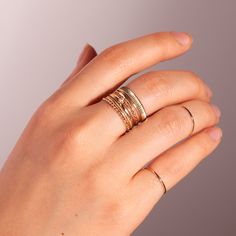 A shiny and shimmering coin-edged ring to wear on its own, or to add to a stack. Throw a coin in the metaphorical fountain! Fine Jewelry Stackable Initial Ring With Round Band, Stackable Initial Ring With Round Band In Fine Jewelry, Gold Engraved Stackable Ring With Round Band, Stackable Yellow Gold Engraved Ring For Everyday Wear, Minimalist Stacked Rings For Anniversary, Fine Jewelry Yellow Gold Stackable Initial Ring, Fine Jewelry Stackable Initial Open Ring, 14k Gold Stackable Midi Rings Fine Jewelry, Minimalist Stacked Anniversary Rings