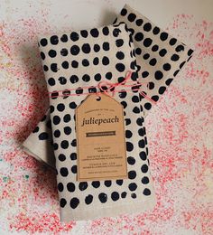 three pieces of paper with black and white polka dots on them