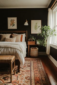 a bedroom with a bed, rugs and pictures on the wall above it's headboard