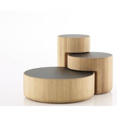 three wooden tables with black leather tops