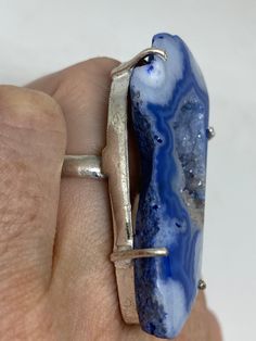 great color blue Lace agate stone The setting is handcrafted in low content silver About 2 inch long Size 6.5 Can be sized. My jeweler charges between $10-$15. All rings are shipped free in the US in a nice gift box. Check out our over a THOUSAND great reviews Engraving is $4 per letter and is not always perfect depending on the piece. It can take a few days if the jeweler is busy. This is payable to Paypal Judithsltd@gmail.com Handmade Blue Agate Rings, Handmade Blue Geodes As Gifts, Handmade Blue Geodes For Gifts, Handmade Blue Geodes For Gift, Handmade Blue Geodes As A Gift, Artisan Blue Ring, Artisan Blue Rings One Of A Kind, Blue Agate Jewelry With Large Stone, Lace Agate Stone