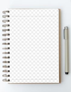 an open notebook and pen on a white surface