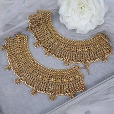 Our biggest bold antique gold polki crystal stone and tiny pearl anklets with jhumka anklets, payal, jhanjara. Anklets width: 2.5 inch with jhumka 3 inches approx. One size fits all/Adjestable to fit Pair Of Anklets. A photo can not do justice. Trust me it is so beautiful in person. Jewelry Care -- Keep all the jewelry away from water, perfumes, and other harsh chemicals To clean wipe with a lint-free cloth to retain the shine Payal Indian, Anklets Indian, Pakistani Jewellery, Bridal Anklet, Dope Jewelry Accessories, Anklet Designs, Crystal Anklet, Pearl Anklet, Fancy Jewellery Designs