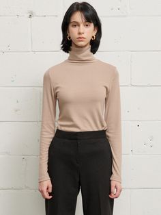 Editor's notesSoft and stretchy, this knit top has turtleneck silhouette and slim fit. Match yours with any items for an essential, cozy style. - Soft and stretchy- Slim fit- Turtleneck silhouette- Versatile stylingMeasurements(in.)Size One Size(XS-M)- Length: 24.80 in - Neck length: 6.69 in - Shoulder: 13.39 in - Bust: 13.78 in - Sleeve: 23.62 in * Model info: Height 5' 8 Bust 29 Waist 22 Hip 33Composition & Care- 67% Rayon, 28% Wool, 5% Spandex - Dry Cleaning Designer- by Jude McCall Fitted Beige Turtleneck For Winter, Beige Fitted High Neck Top, Fitted High Neck Beige Tops, Beige Turtleneck For Workwear In Fall, Fitted Beige Turtleneck For Spring, Fall Beige Turtleneck For Workwear, Beige Stretch Turtleneck, Second-skin Turtleneck Tops For Fall, Spring Beige Turtleneck For Workwear