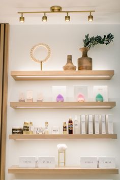 the shelves are filled with cosmetics and personal care items