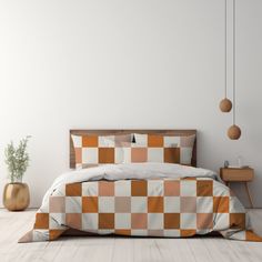 a bed with an orange and white checkered comforter