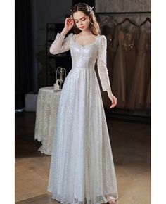 Full Sleeves Prom Dress, Long Sleeve Fitted Prom Dress, Long Prom Dress With Sleeves, White Sparkle Dress Long, Sparkly Modest Dress, Silver Long Dress Formal Gowns, Modest Sparkly Dress, Modest Sequin Dress, Fitted Long Sleeve Winter Gown