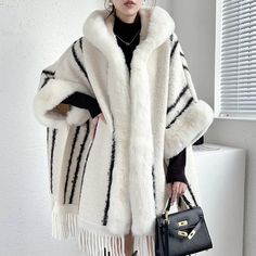 Elegant Winter Outerwear With Tassels, Winter Fringe Cape Outerwear, Chic White Winter Cape, Winter Cape With Tassels, Winter Fringe Shawl Outerwear, Elegant White Poncho For Winter, Elegant White Winter Poncho, Winter Shawl With Tassels, Winter Shawl Cape With Fringe