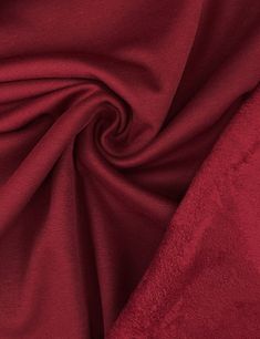 a close up view of a red fabric