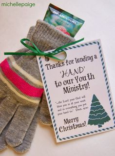 a pair of mittens with a thank card attached to the tag that says, thanks for leaving a hand to our youth in merry christmas