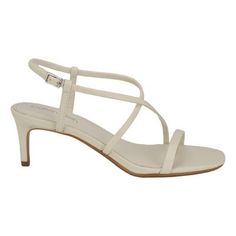 Step out in style in the Calvin Klein Ishaya dress sandal. This sandal features a strappy silhouette, stiletto heel and modern square toe. The perfect wardrobe staple! Founded in New York in 1968, the brand elevates everyday essentials to globally iconic status. | Calvin Klein Women's Ishaya Strappy Stiletto Dress Sandals, Ivory, 8.5M Chic Fitted Sandals With Straps, Chic Fitted Strap Sandals, Modern Beige Party Sandals, Fitted Strappy Slingback Sandals For Spring, Evening Sandals With Square Toe In Cream, Cream Sandals With Square Toe For Evening, Cream Square Toe Sandals For Evening, Elegant White Sandals With Straps, Chic Fitted Strappy Slingback Sandals