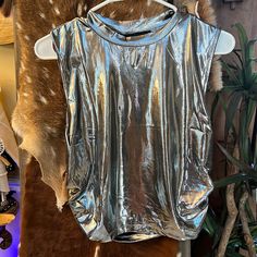 Trendy Metallic Silver High Neck Cropped Top. Brand New With Tags Never Worn!!!!! This Top Pairs Perfect With Metallic Silver Cargo Pants (Check Out My Other Listing). Perfect For Concert!!! Disco Style Shiny Tops For Night Out, Trendy Shiny Top For Night Out, Metallic Top With Sheen For Night Out, Trendy Shiny Tops For Night Out, Metallic Sheen Tops For Night Out, Metallic Sheen Top For Night Out, Spring Disco Shiny Tops, Metallic Shine Tops For Night Out, Shiny Stretch Trendy Tops