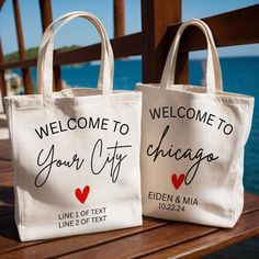 two bags with the words welcome to your city chicago and eden & mia on them