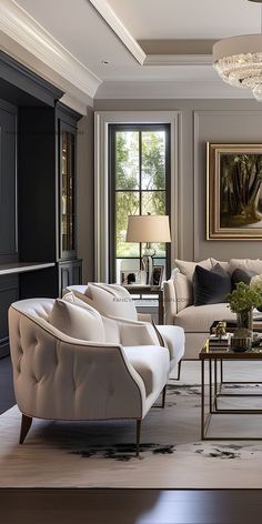 a living room filled with furniture and a chandelier