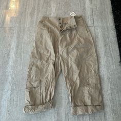 Size Medium High Waist Beige Utility Bottoms, Beige Utility Trousers, Spring Utility Ankle-length Pants, Khaki Utility Ankle-length Pants, High Waist Beige Parachute Pants For Work, Beige High Waist Parachute Pants For Work, Beige Cargo Style Ankle-length Bottoms, Utility Style Beige Spring Pants, Cargo Pant