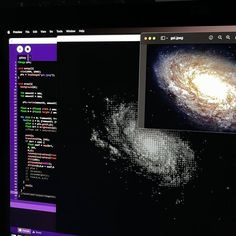 a computer screen with an image of a spiral galaxy on it