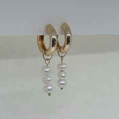 Beautiful earrings with freshwater pearls. The golden creoles add to her elegant look and the earrings go perfectly with an elegant outfit, but can also be worn every day. What makes our jewelry special? 🌊 The high-quality, gold-plated stainless steel makes the jewelry waterproof ✨ No discoloration, no green edges 🌿 Allergy-friendly 🫀 each piece of jewelry is selected with love and lovingly packaged 🤍 we do good! We donate part of our income to charitable causes and projects. We will keep yo 14k Gold Filled Pearl Drop Earrings For Anniversary, Anniversary 14k Gold Filled Pearl Drop Earrings, Elegant White Huggie Jewelry, Classic Pearl Pendant Earrings In 14k Gold Filled, Elegant Everyday Pearl Huggie Earrings, Elegant Gold Huggie Earrings With Pearl Charm, Gold Small Hoop Earrings With Pearl Chain, Elegant Gold Pearl Huggie Earrings, Gold Hoop Earrings With Pearl Pendant