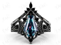 a black diamond ring with an aqua blue stone in the center and white diamonds around it