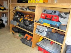 a room filled with lots of different types of toolboxes and other tools on shelves