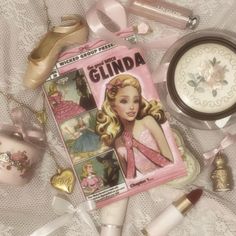 there is a magazine and cosmetics on the table