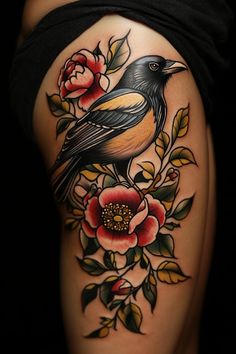 a bird sitting on top of a flower next to a black and yellow tattoo design