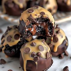 chocolate covered desserts are stacked on top of each other