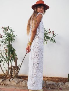 Super cute long white crochet dress with lots of detailed hand work. We hand source antique and vinatage crochet & lace textiles and up-cycle it here in Ibiza in to unique on off a kind garment just for you. Due to the nature there could be some imperfections but we do our best to only recycle mint condition textiles. Size is small-medium Condition is perfect Sleeveless Crochet Lace Dress For Festival, Summer Lace Work Maxi Dress, Maxi Length Crochet Dress With Lace Trim For Beach, Lace Trim Maxi Length Crochet Dress For The Beach, White Bohemian Crochet Top With Lace Work, Bohemian Crochet Lace Dress For Vacation, Lace Crochet Maxi Length Dress, Bohemian Beach Cover-up Dress With Lace Patchwork, Bohemian Cotton Lace Dress With Crochet Trim