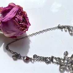 "Beautiful and authentic swan marked Swarovski silver and crystal bib necklace. Crystals are of a very light smokey romantic color. The length is adjustable, can be anything from 15.5\" to 17.5\". Versatile, feminine and elegant, it can dress up any outfit. It has multiple tear drop faceted crystals hanging on a silver chain. An additional silver chain is mounted to hang below the crystals. The necklace has a lobster clasp with a swan on it, and a small swan tag with round crystals and another s Glamorous Crystal Necklace As A Gift, Glamorous Silver Crystal Necklace For Gift, Silver Crystal Necklace For Jewelry Making, Delicate Silver Crystal Necklace With Adjustable Chain, Delicate Silver Necklace For Evening, Crystals Hanging, Swan Logo, Romantic Colors, Hand Painted Signs