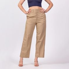 Vintage 70s khaki high waisted trousers with a straight leg. Originally men's, but can work on women's sizing as well.  Measurements and Condition: Fits like: Has a unisex fit - men's small, women's medium Fabric: Feels like cotton/poly - labeled machine washable Brand: None, tag was cut out by previous owner. Labeled made in USA. Condition: Very good, with light general wear, some pilling on the seat/inner thighs, and a 1/4" and tiny brown spot on the back of the right thigh. Waist: 29.5" Hips: Khaki High-waisted Chinos For Work, High-waisted Khaki Chinos For Work, High Rise Beige Wide Leg Pants For Work, Beige High Rise Wide Leg Pants For Work, Khaki High-rise Cargo Pants For Workwear, High Rise Khaki Cargo Pants For Work, Retro High Rise Pants For Work, Classic High Rise Beige Pants, Classic Beige High Rise Pants