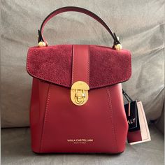 Beautiful Burgundy Bag With An Extra Strap, Can Be Worn In Multiple Ways ( Carry By Handle, Shoulder Strap, As A Backpack) Leather And Suede. Made In Italy. Gold Tone Hardware. 9” Wide, 12” Tall. Luxury Burgundy Bag With Detachable Strap, Luxury Burgundy Crossbody Bag, Elegant Burgundy Flap Bag For Travel, Luxury Burgundy Evening Bag, Elegant Red Flap Bag With Top Carry Handle, Evening Bag With Detachable Handle In Burgundy, Evening Burgundy Satchel With Gold-tone Hardware, Burgundy Evening Bag With Removable Pouch, Evening Burgundy Bag With Detachable Handle