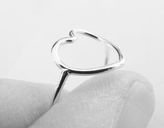 "Gorgeous simple minimalistic heart ring! Beautiful and subtle accent made just for those tiny little statements! A delicate open style heart made with sterling silver attached to a slim 18 gauge (1mm)band is handcrafted, soldered, and then straight edge hammered for a semi flat effect on the heart. So beautiful and makes that subtle statement of class! 100% soldered for strength and the heart is open for a modern fashion design. Heart Dimensions: Approx 9.6 x 10.3mm Material is solid .925 recyc Modern Style Design, Silver Heart Ring, Rings Simple, Stackable Rings, Silver Heart, Heart Ring, Ring, Silver Rings, Band