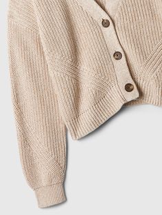 Soft cotton knit. Dropped shoulder, long sleeves with ribbed, banded cuffs. V-neck, button front. Select styles have allover stripes. #828047 Casual V-neck Sweater With Buttons, Casual Long Sleeve V-neck Sweater With Buttons, Knit V-neck Sweater With Button Closure And Long Sleeves, Beige Ribbed Cuffs V-neck Sweater For Fall, Casual Knit V-neck Sweater With Ribbed Cuffs, Trendy Cotton V-neck Sweater For Fall, Ribbed Cotton V-neck Cardigan, Casual Button-up Ribbed Sweater, Beige Knit Cardigan With Ribbed Cuffs