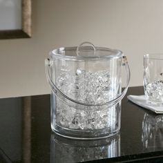 two glasses and a container on a table