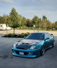 a blue car parked in a parking lot