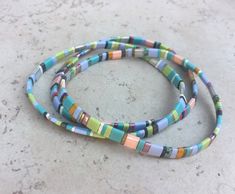 "3 Colorful stackable bracelet bangles in pastel colors. Can be worn together or separately. The width measures 3/8\" and the diameter measures 2.75\"." Multicolor Stackable Bracelets For Friendship, Multicolor Stackable Friendship Bracelets, Multicolor Stacked Bracelets As Gift, Multicolor Stackable Bangle Stretch Bracelet, Multicolor Stackable Bangle Bracelet, Woven Bracelets Diy, Woven Bracelet Diy, Tila Bracelets, Stackable Beaded Bracelets