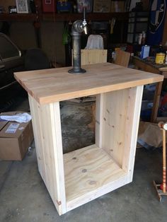 a workbench made out of plywood in a garage