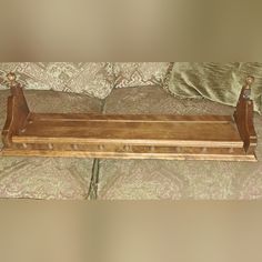 a wooden bench sitting on top of a couch