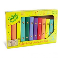 an assortment of colorful wooden music instruments in a box