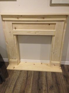 an unfinished fireplace surround made out of wood