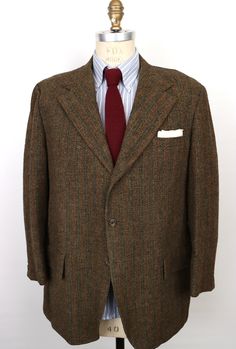 "\"Guest of Honor\" vintage 1970s (to late 60s) Harris Tweed sport coat by historic menswear label Hampton Clothes in rich, dark brown-ish, green-ish 100% virgin Scottish wool Harris Tweed with vintage high quality you can see and feel and a charming, subtle multicolor vertical weave to the tweed that gives it added warmth and dimension, featuring: 3-button front with shorter, wider notch lapel and swollen \"French seams\" or edges, and textured dark brown buttons that evoke bark; welt chest poc Brown Wool Sport Coat With Flat Front, Vintage Wool Sport Coat With Welt Pockets, Vintage Wool Sport Coat With Lapel Collar, Vintage Brown Tweed Jacket With Lapel Collar, Vintage Wool Sport Coat Single Breasted, Vintage Wool Single Breasted Sport Coat, Vintage Single Breasted Tweed Jacket For Tailoring, Tailored Vintage Tweed Jacket, Vintage Wool Single-breasted Sport Coat